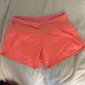 Lululemon, size 4 bright orange running shorts